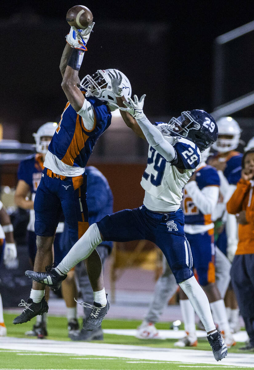 Legacy wide receiver Dominic Oliver (1) sis unable to secure a critical catch as Shadow Ridge d ...