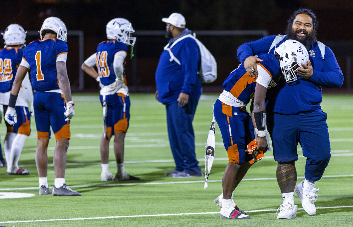 Legacy halfback Caden Bridgewater (3) weeps fun the arms of a coach as they lose to Shadow Ridg ...