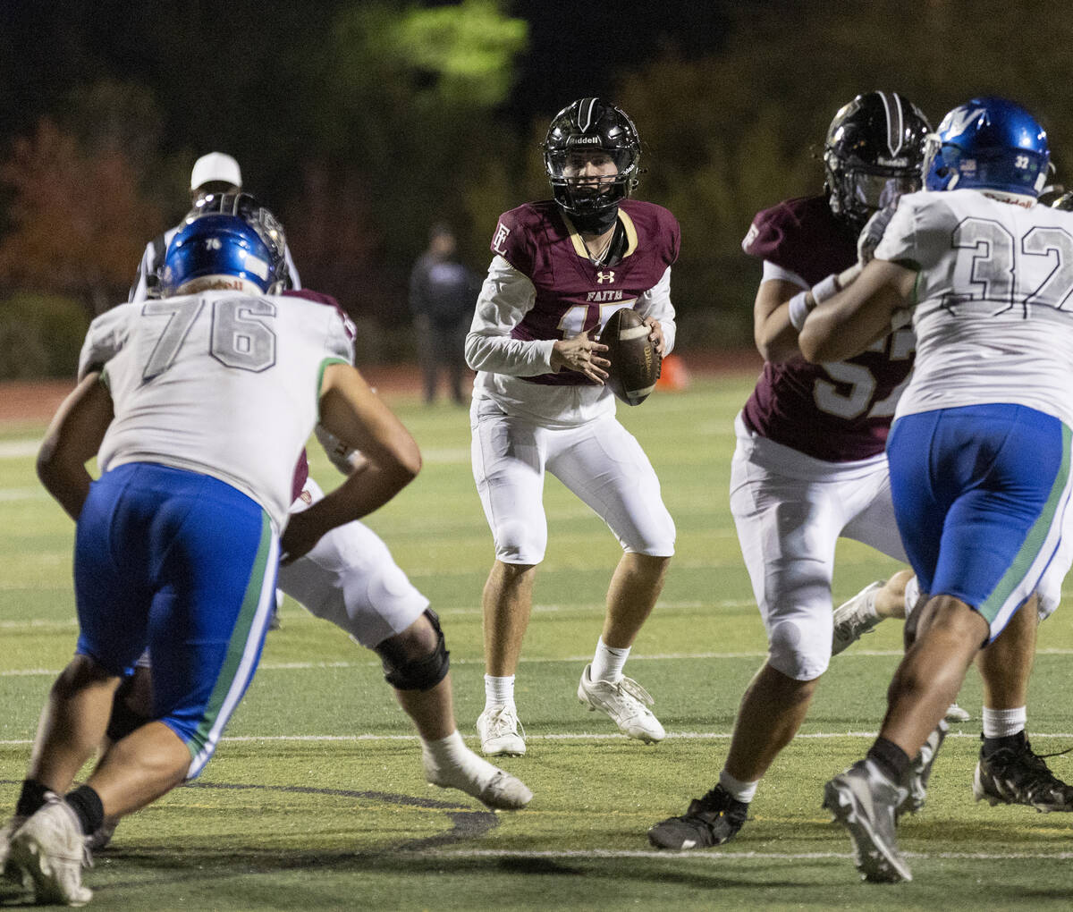 Faith Lutheran senior Alexander Rogers (15) looks to throw the ball during the 5A Division II S ...