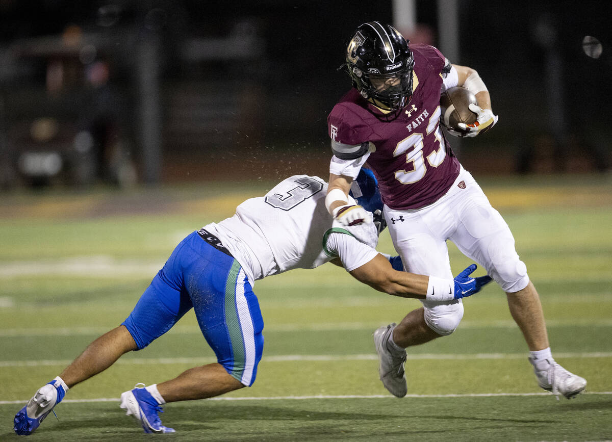 Faith Lutheran junior Justin Robbins (33) tries to avoid Green Valley senior Esteban Martinez ( ...