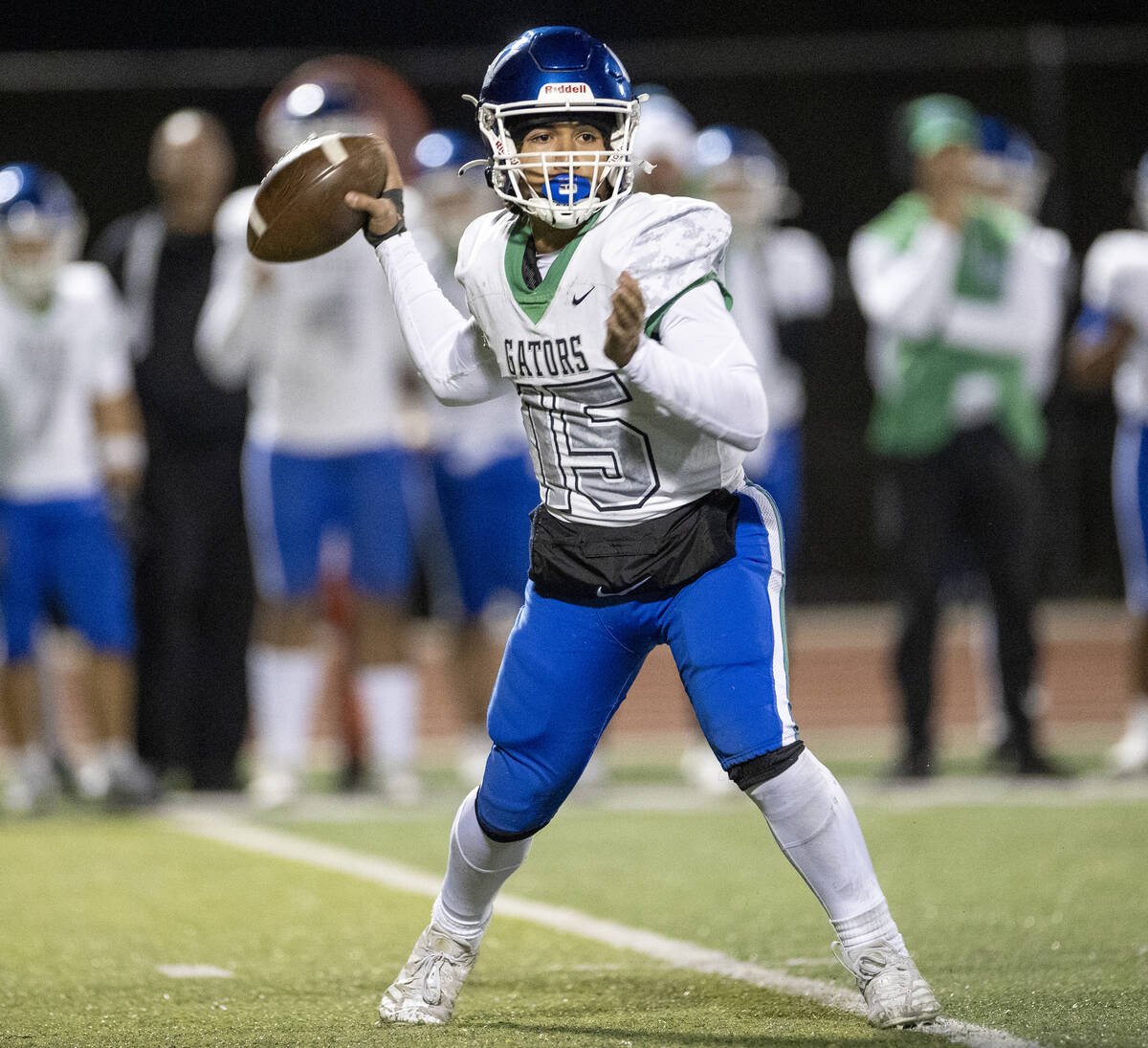 Green Valley quarterback Michael Lewis (15) looks to throw the ball during the 5A Division II S ...