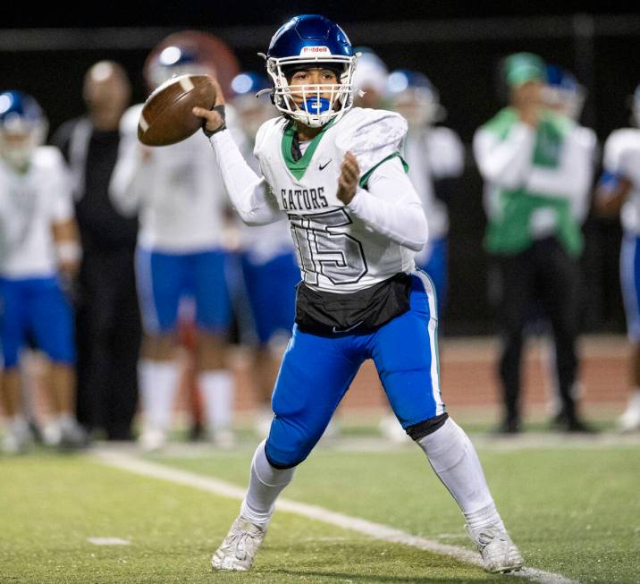 Green Valley quarterback Michael Lewis (15) looks to throw the ball during the 5A Division II S ...