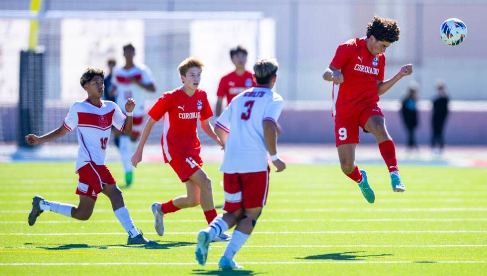 Coronado striker Dylan Flores (9) heads the ball upfield as Wooster midfielder Jiovanni Villa H ...