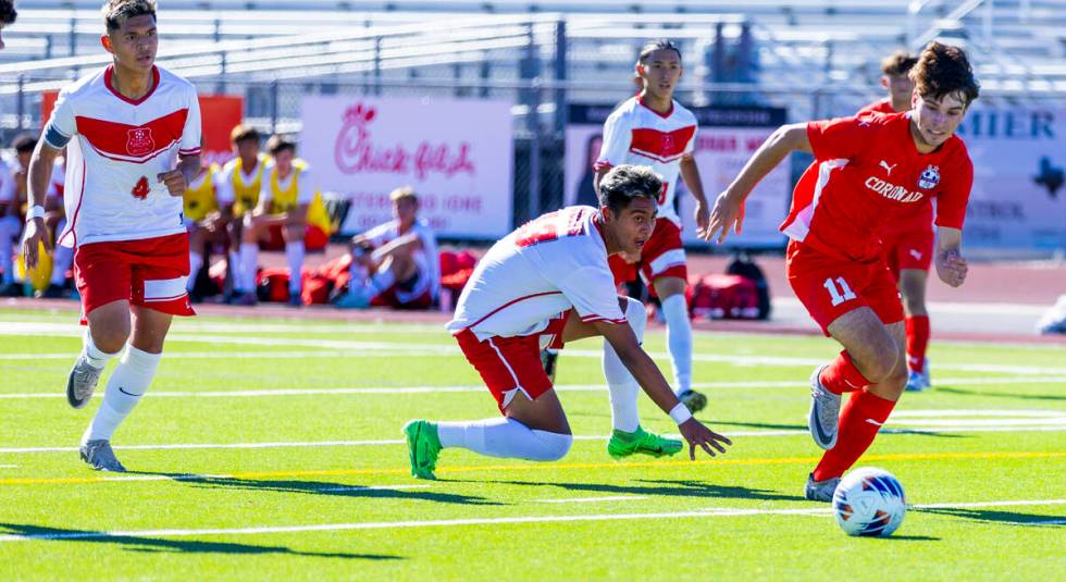 Coronado striker Gavin Flickinger (11) gets past Wooster Daemian Guzman (13) for a scoring atte ...