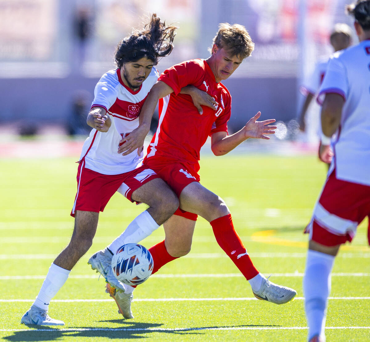 Wooster midfielder Luis Lopez Martinez (17) battles for the ball with Coronado forward Maddox F ...