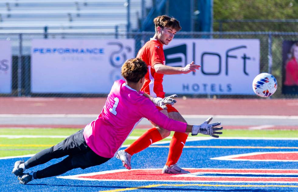 Coronado striker Gavin Flickinger (11) kicks the ball past Wooster goalkeeper Jason Acosta Plas ...