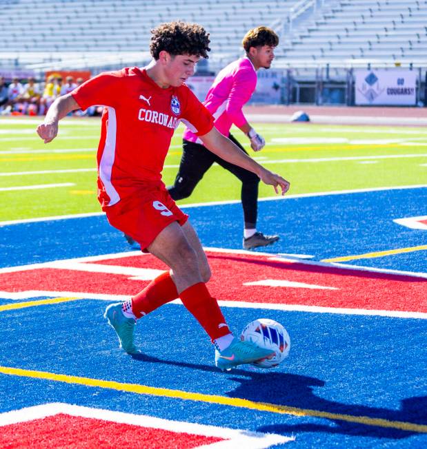 Coronado striker Dylan Flores (9) kicks another goal as Wooster goalkeeper Jason Acosta Plascen ...