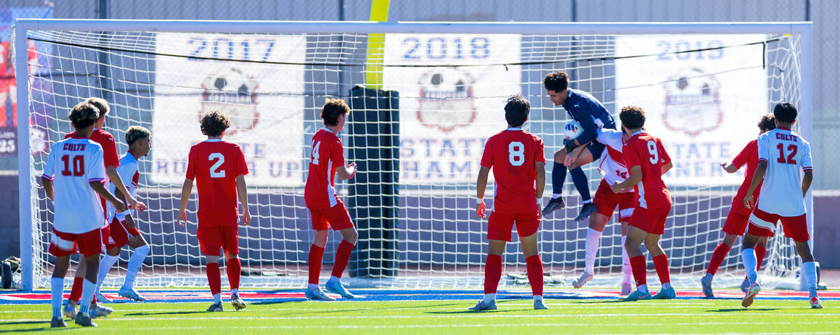 Coronado goalkeeper Logan Pierce (13) saves a corner kick against Wooster Matias Gutierrez Duar ...