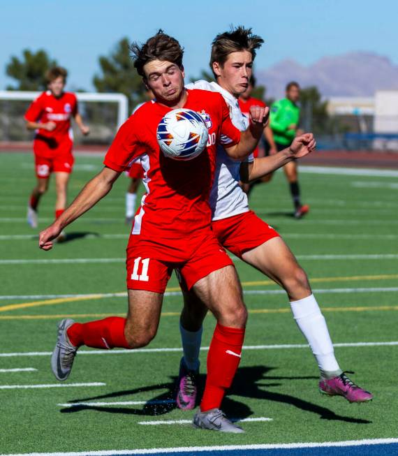 Coronado striker Gavin Flickinger (11) battles past Wooster defender Christopher Noguera Aguirr ...