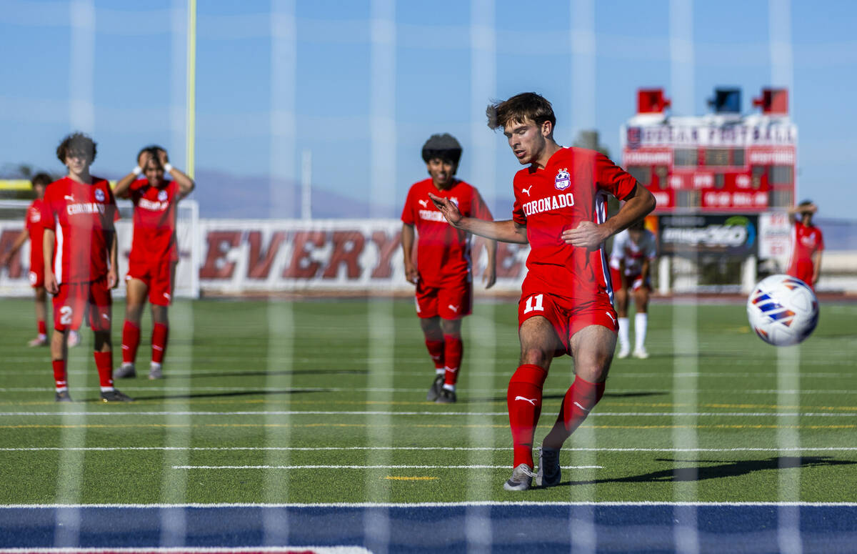 Coronado striker Gavin Flickinger (11) scores against Wooster on a penalty kick to set a state ...