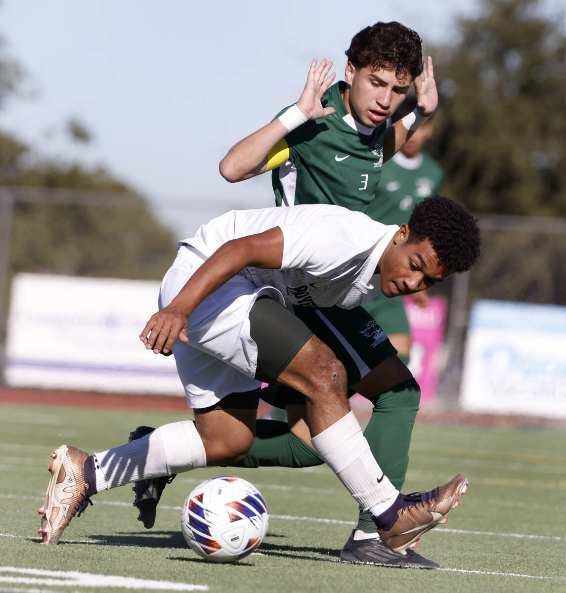 Palo Verde High's forward Trevon Aytch (15) protects the ball from Hug High's defender Jordan G ...