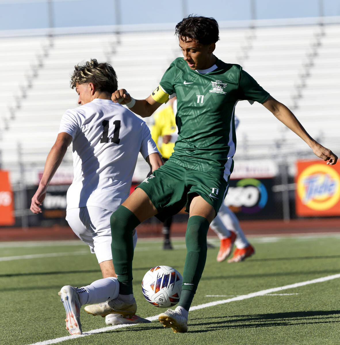 Palo Verde High's forward Noah Johnson, left, collides with Hug High's forward Vicente Villalob ...