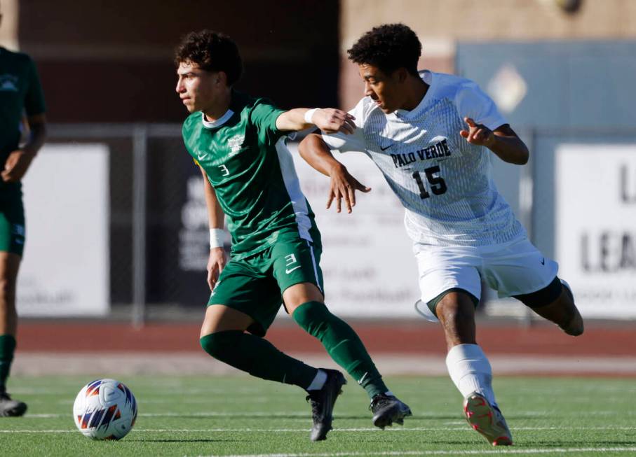 Hug High's defender Jordan Gomez (3) protects the ball from Palo Verde High's forward Trevon Ay ...