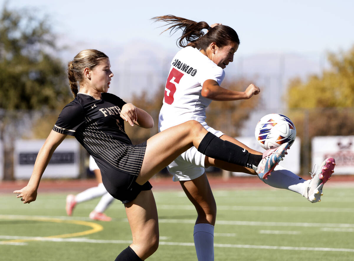 Faith Lutheran's forward Olivia Stark (8) and Coronado High's forward Abby Obregon (5) fight fo ...