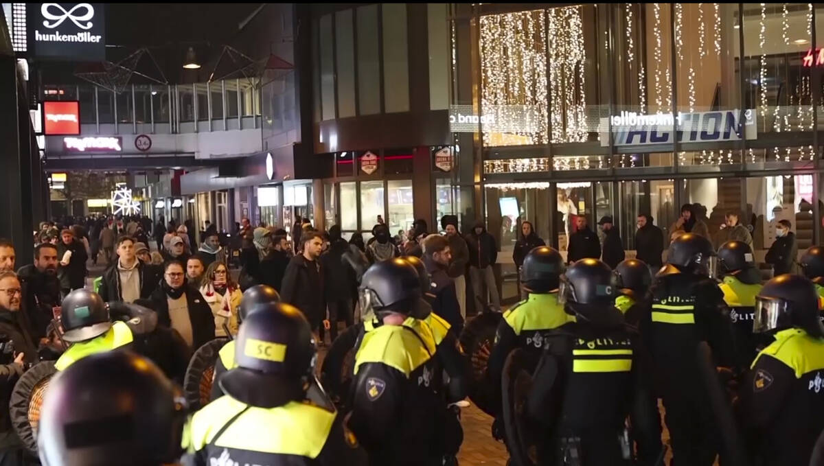 In this image taken from video, police stand guard forming a line near the Ajax stadium, in Ams ...