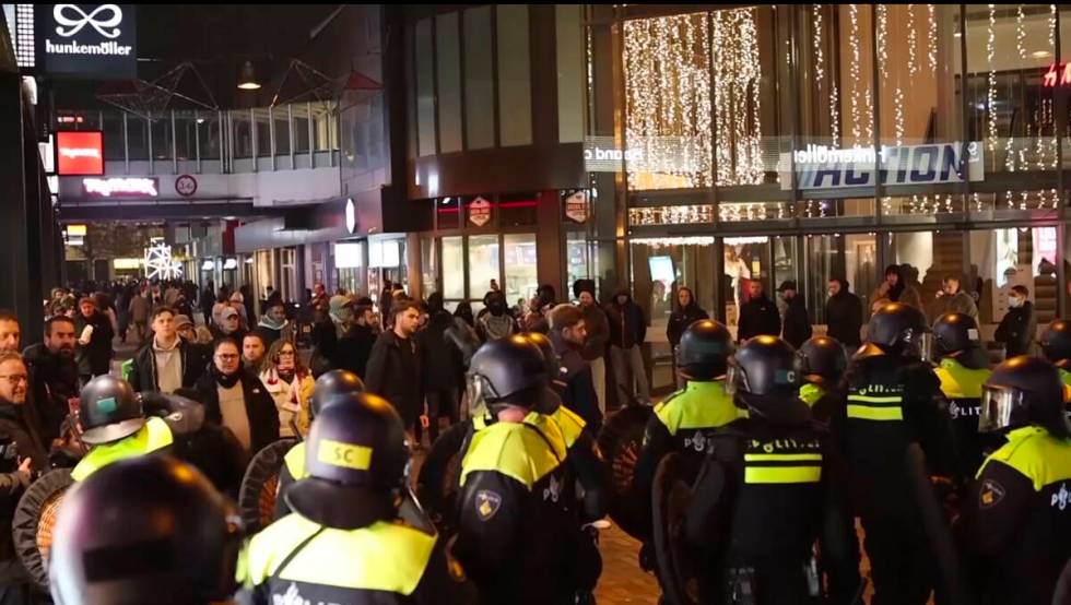 In this image taken from video, police stand guard forming a line near the Ajax stadium, in Ams ...