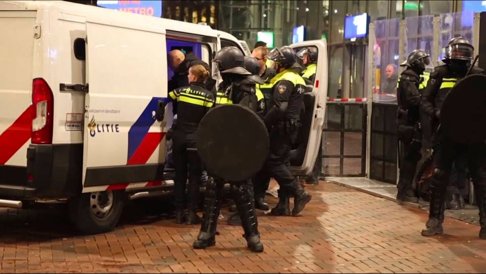 In this image taken from video, police detain a man near the Ajax stadium, after pro-Palestinia ...