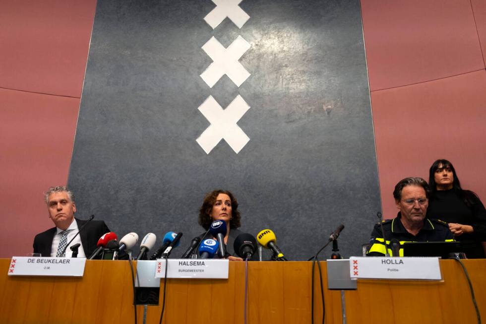 Amsterdam's Mayor Femke Halsema, centre, acting Amsterdam police chief Peter Holla, left, and h ...