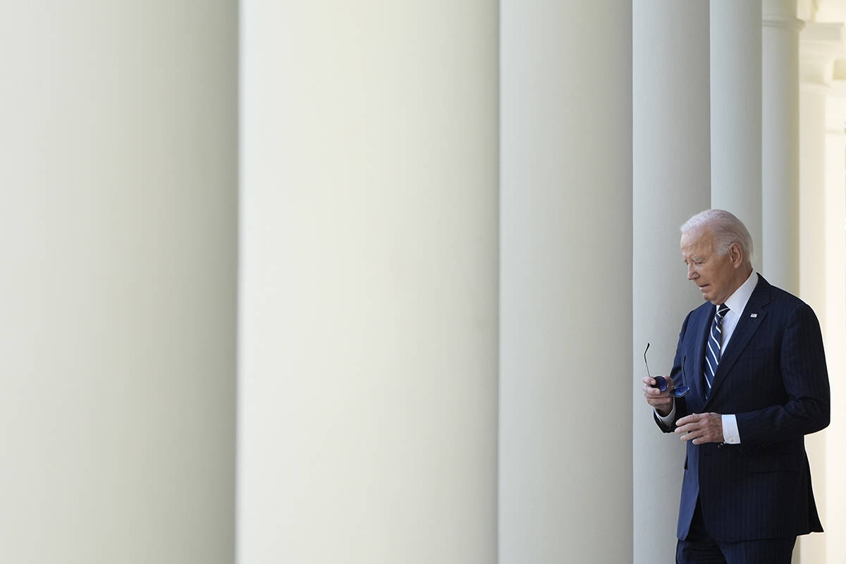 President Joe Biden walks to speak in the Rose Garden of the White House in Washington, Thursda ...