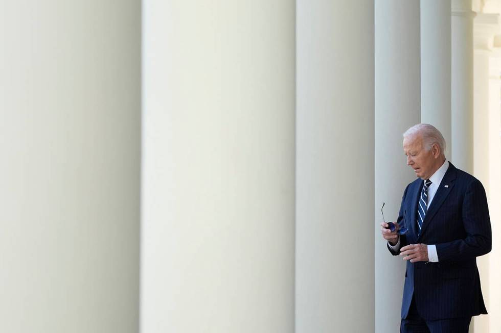 President Joe Biden walks to speak in the Rose Garden of the White House in Washington, Thursda ...