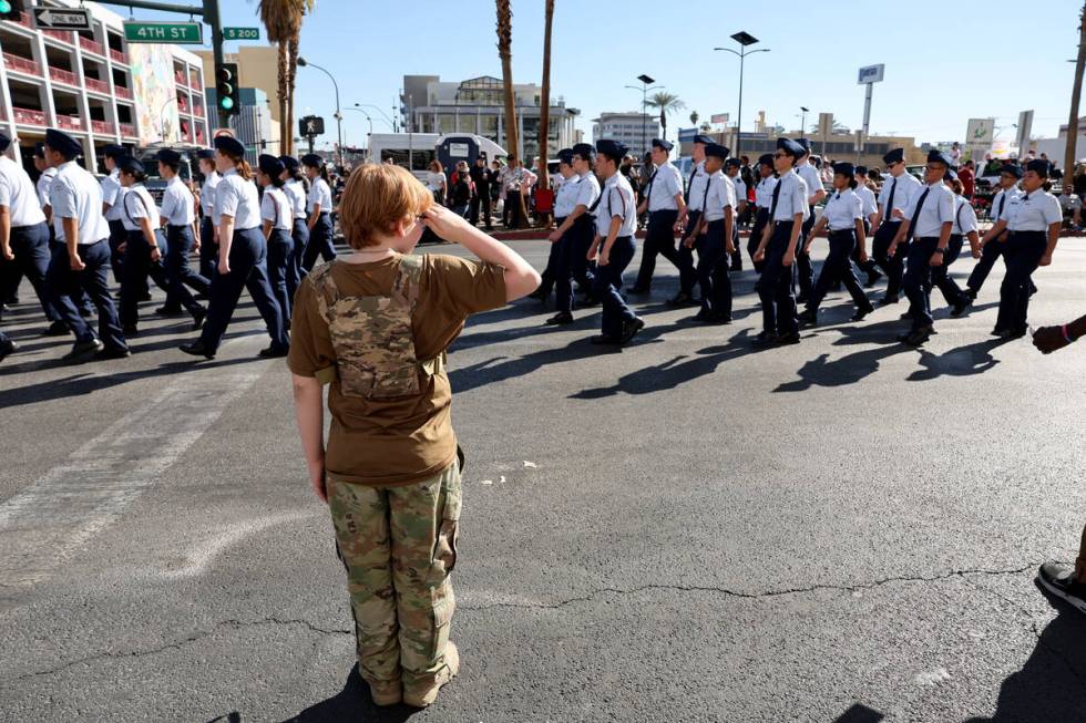 Andrew Peterson, 11, salutes during the Las Vegas Veterans Day Parade downtown Monday, Nov. 11, ...