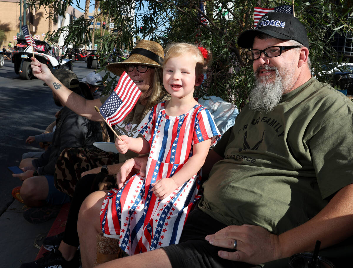 Onaleeya Carney, 2, and her Air Force veteran grandparents Dinah Carney and an Carney watch the ...