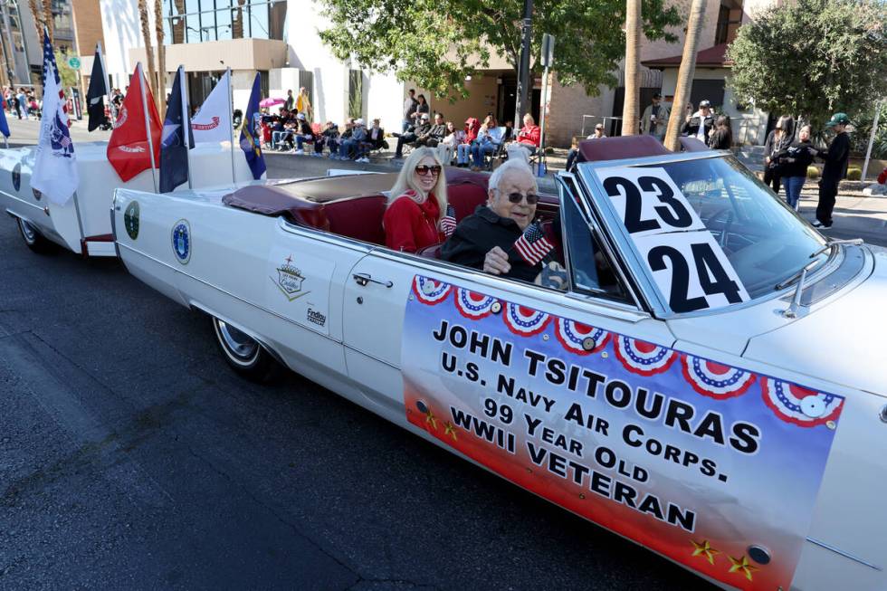 Ninety-nine year old veteran John Tsitouras waves to the crowd during the Las Vegas Veterans Da ...