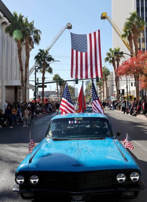 Las Vegas Cadillac Club drives veterans during the Las Vegas Veterans Day Parade downtown Monda ...