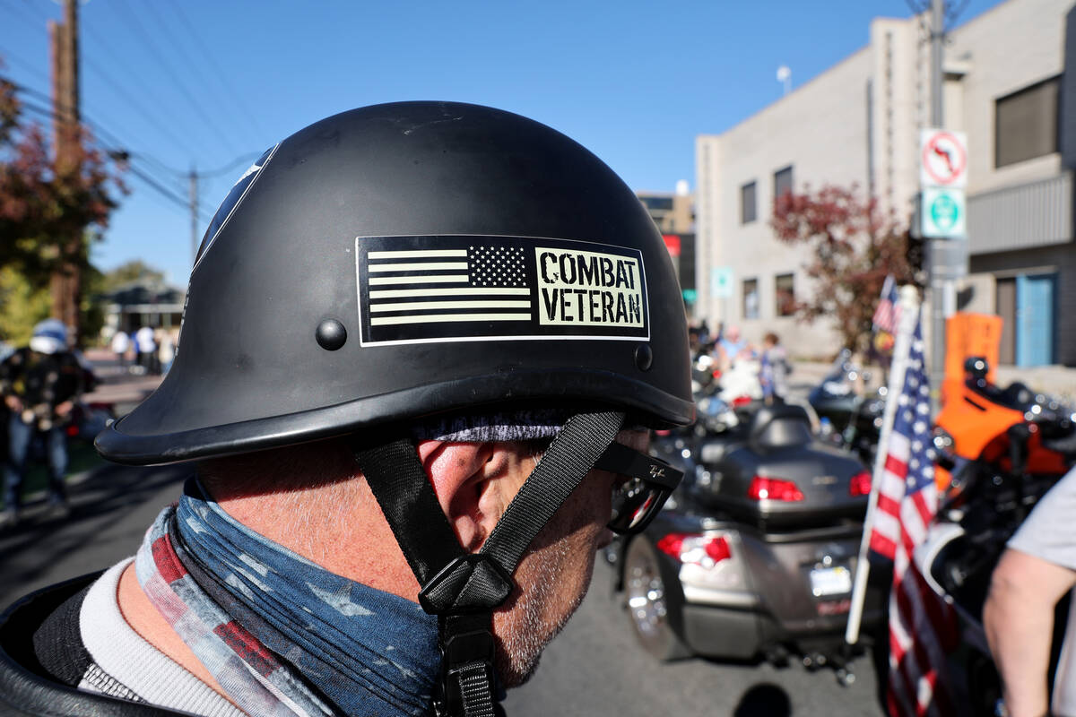 Scott White with Combat Veterans Motorcycle Association Nevada NV 41-1 prepares to ride in the ...