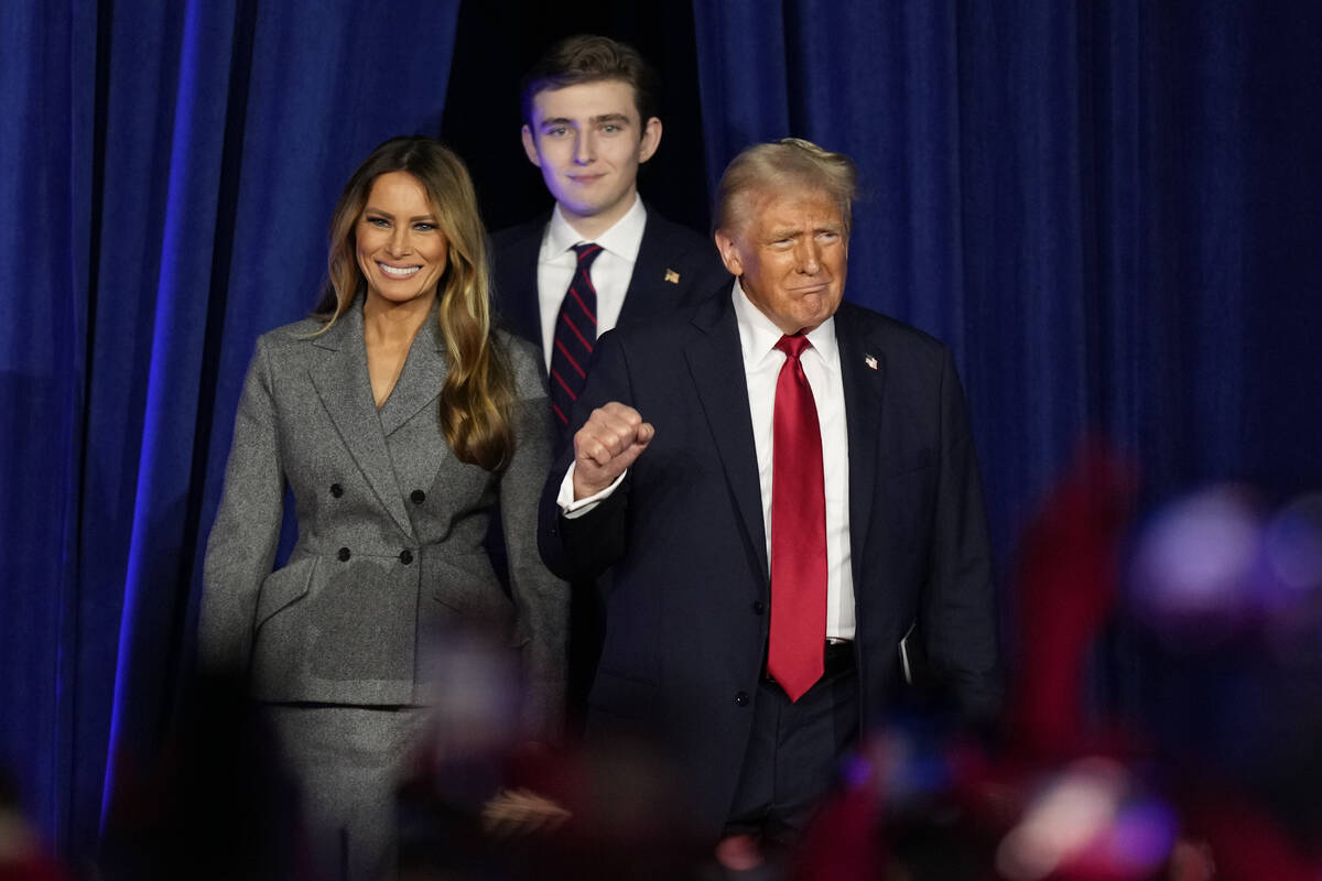 Republican presidential nominee former President Donald Trump, joined by Melania Trump, left, a ...