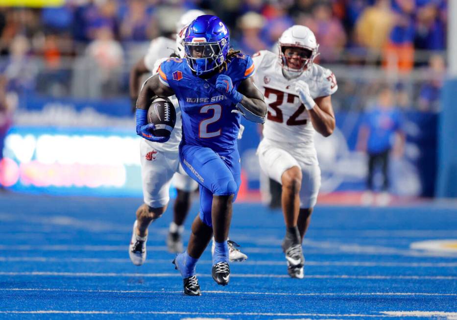 Boise State running back Ashton Jeanty (2) breaks away from the Washington State defense in the ...