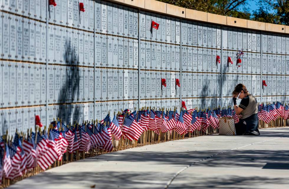 Jill D'Arpino reflects at the marker for her son Michael Kissel at one of the columbarium walls ...