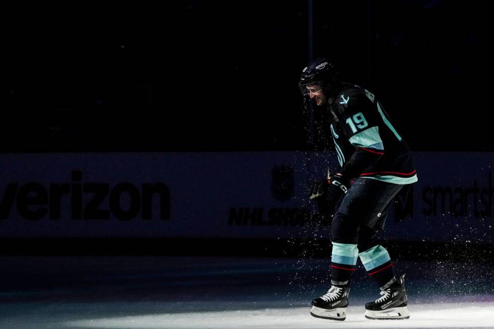 Seattle Kraken left wing Jared McCann smiles after being doused by teammates to celebrate his g ...