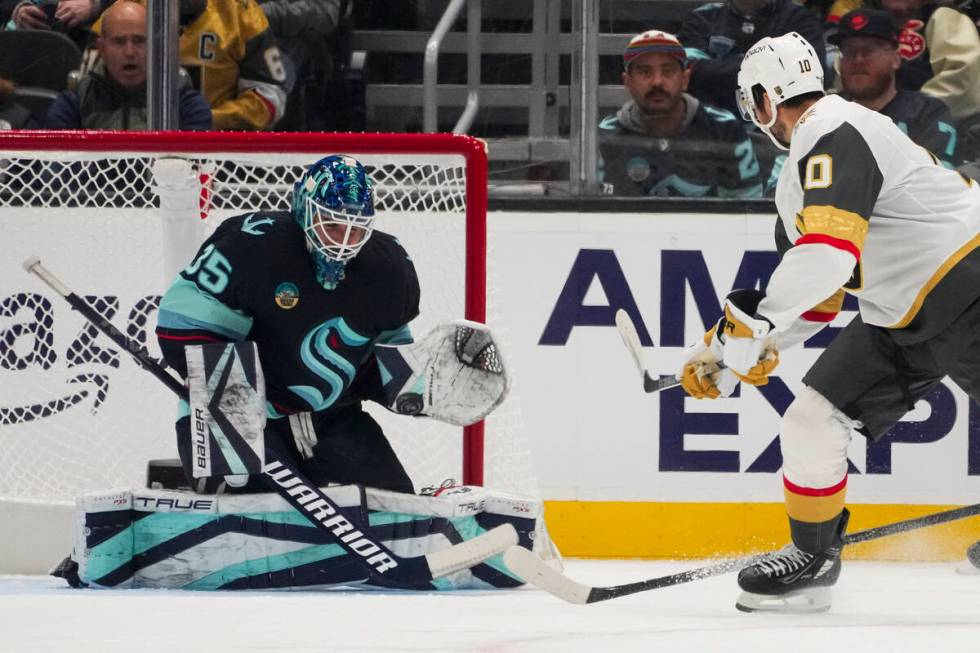 Seattle Kraken goaltender Joey Daccord blocks a shot by Vegas Golden Knights center Nicolas Roy ...