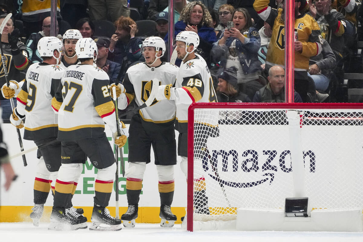 Vegas Golden Knights left wing Pavel Dorofeyev, second from right, celebrates after his goal ag ...