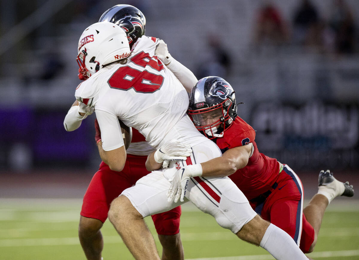 Coronado senior Derek Hurley (5) attempts to tackle Arbor View tight end Zac Fares (88) during ...