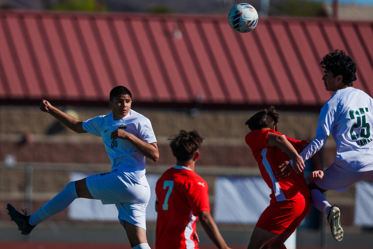 Hug defensive player Omar Estrada (36) jumps up for the ball during a 5A boys soccer state cham ...