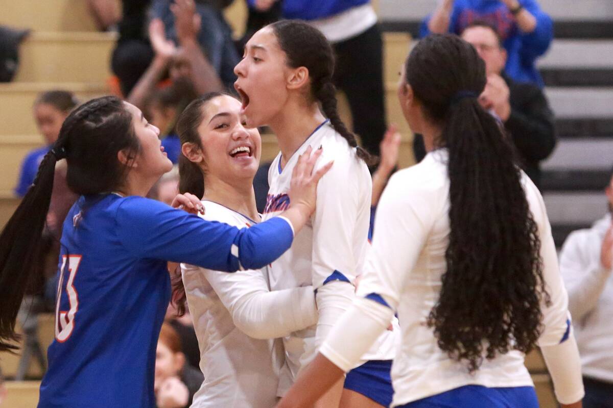 Ayanna Watson (middle) celebrates alongside her teammates after winning a point against Coronad ...