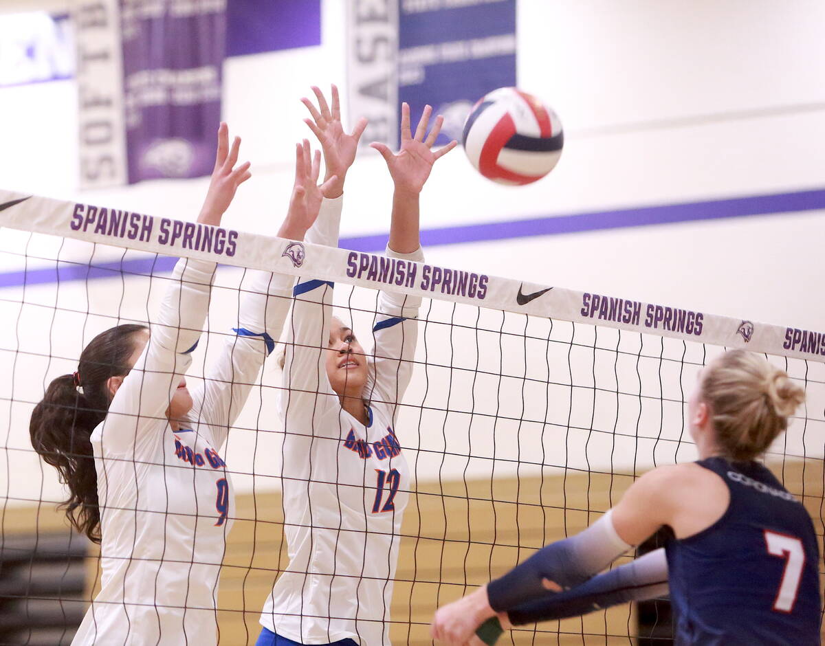 Trinity Thompson (9) and Brooklynn Williams (12) go up for a block against Coronado in the voll ...