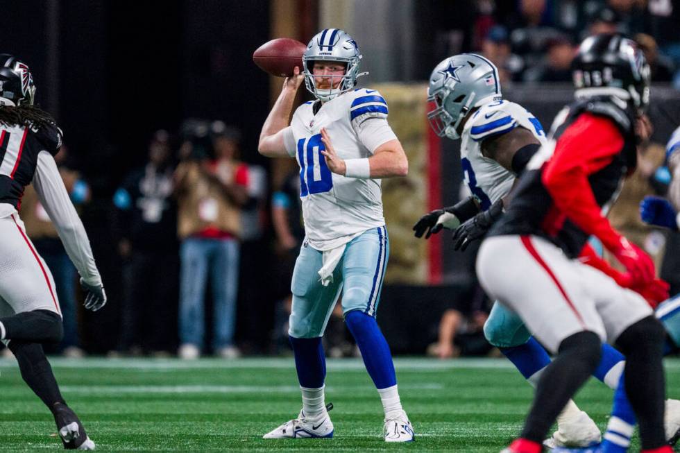 Dallas Cowboys quarterback Cooper Rush (10) throws during the second half of an NFL football ga ...