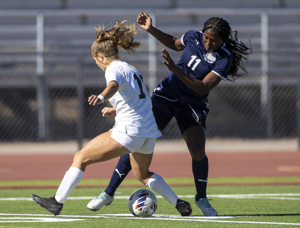 Centennial defender Natalie Penniston-John (11) takes the ball from Galena senior Jane Flynn, l ...