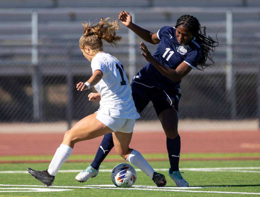 Centennial defender Natalie Penniston-John (11) takes the ball from Galena senior Jane Flynn, l ...