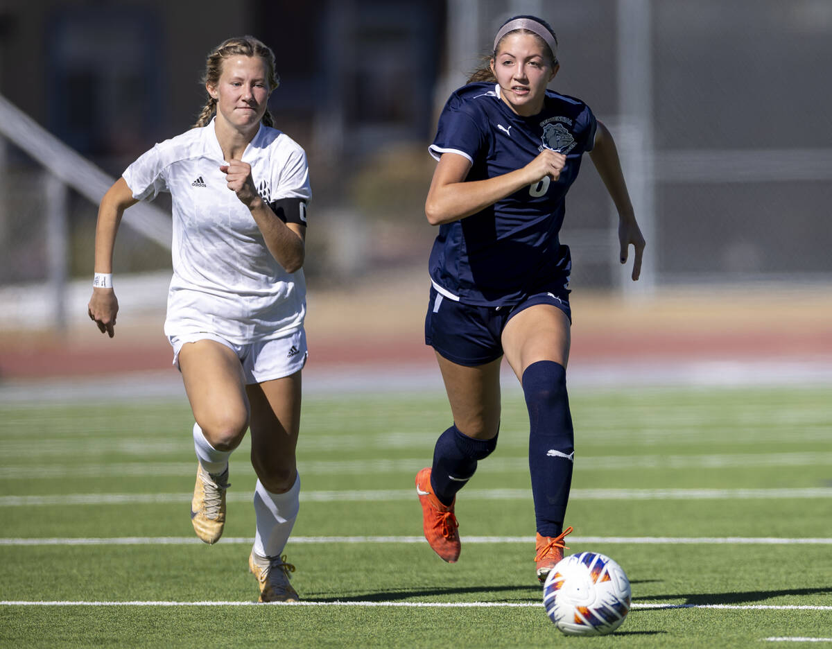 Galena senior Nyla Hensley, left, chases after Centennial defender Ellah Scharringhausen (6) du ...