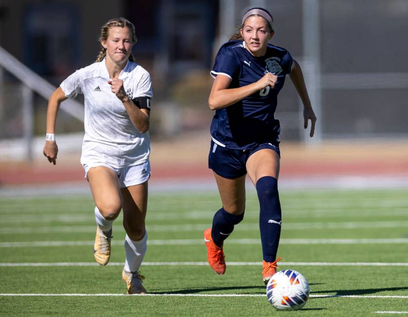 Galena senior Nyla Hensley, left, chases after Centennial defender Ellah Scharringhausen (6) du ...