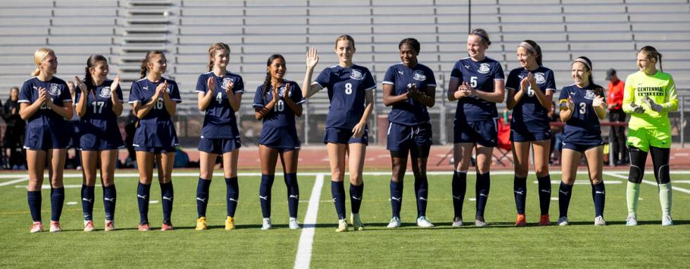 Centennial junior Claire Orme (8) waves as her name is announced before the 4A girls soccer sta ...