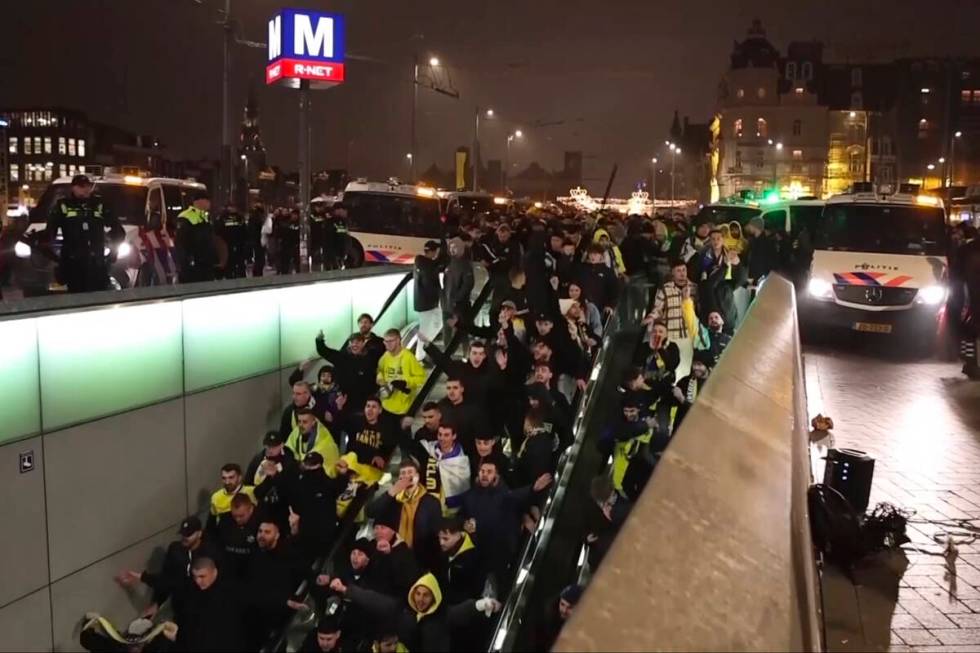 In this image taken from video, police escort Maccabi Tel Aviv supporters to the metro, after p ...