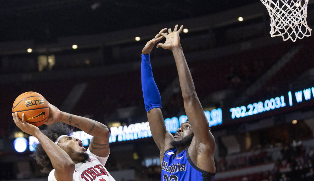 UNLV forward Rob Whaley Jr., left, attempts to shoot over Memphis Tigers center Moussa Cisse, r ...