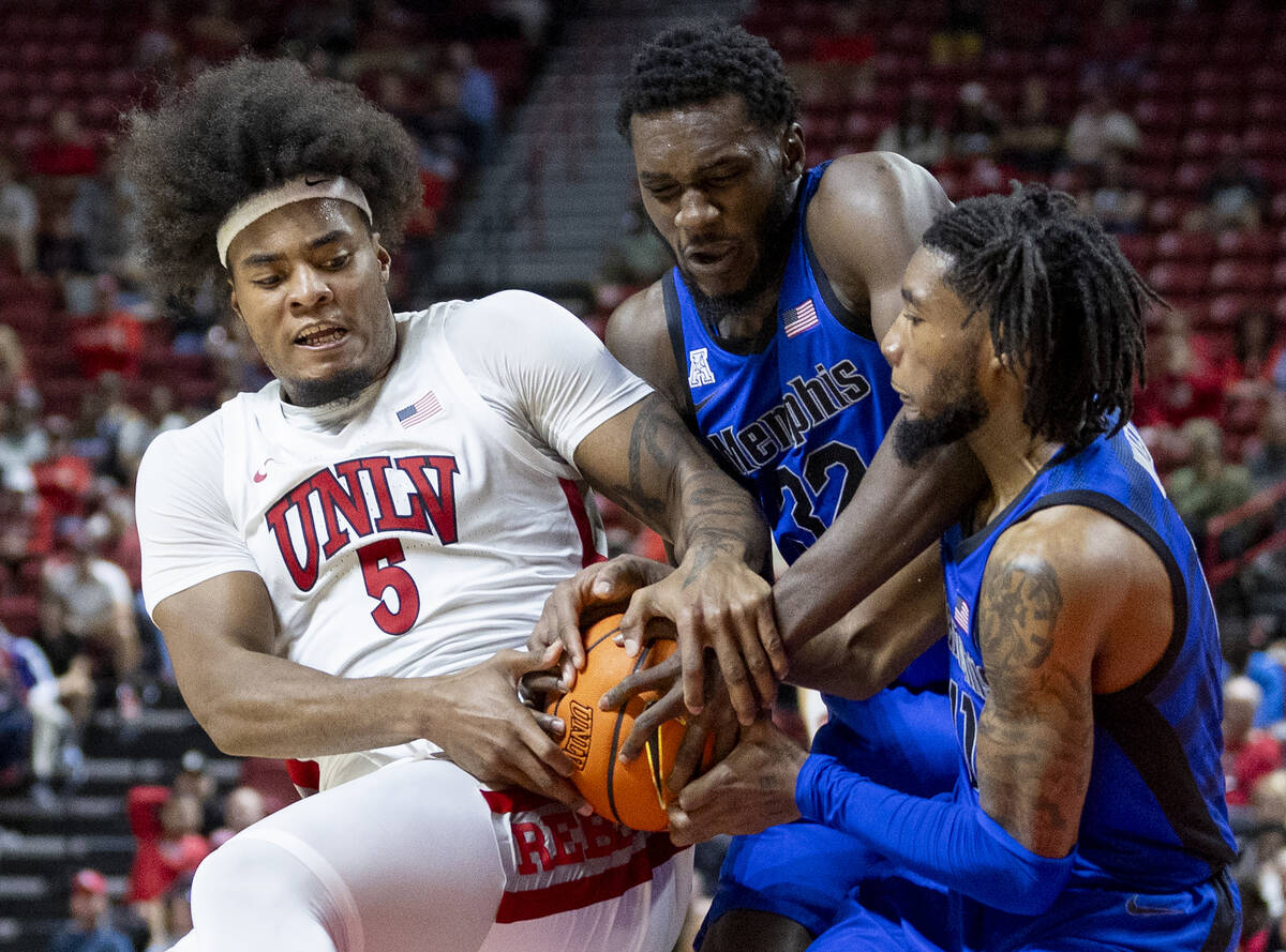 UNLV forward Rob Whaley Jr. (5), Memphis Tigers center Moussa Cisse (32) and Memphis Tigers gua ...