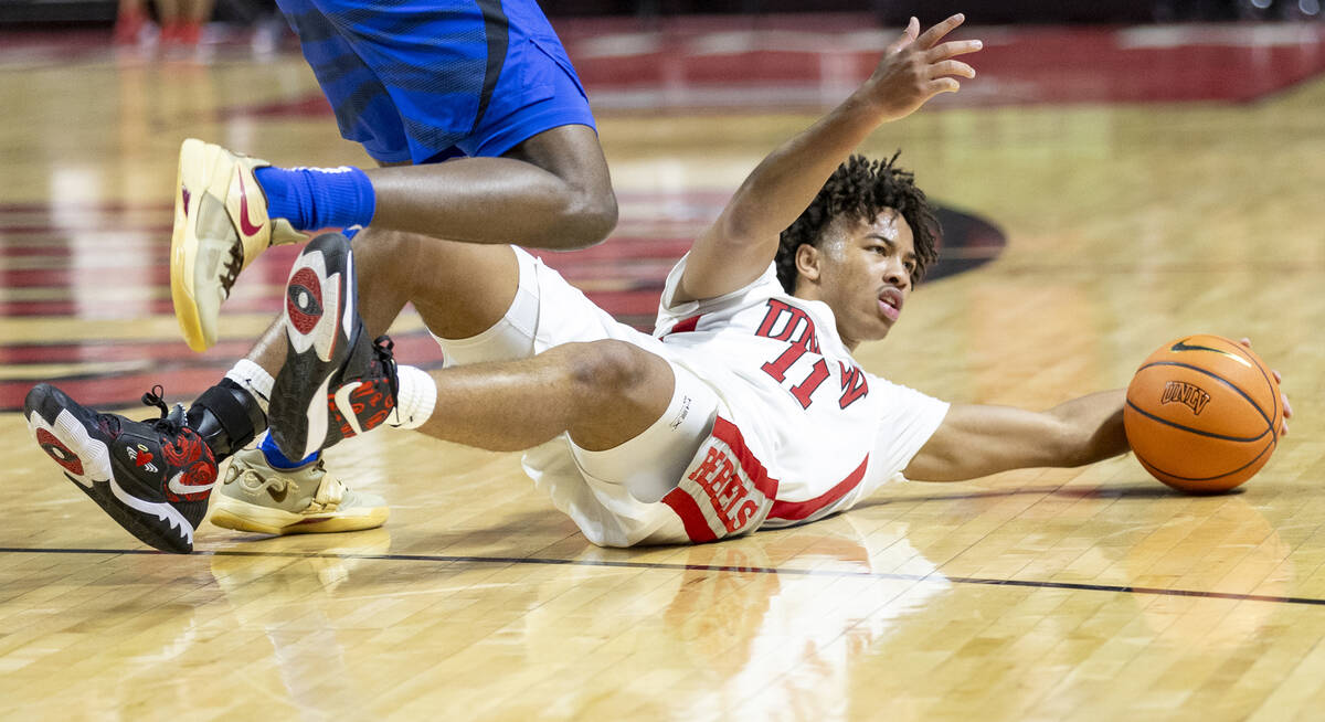 UNLV guard Dedan Thomas Jr. (11) looks for the referee to call a foul during the college basket ...