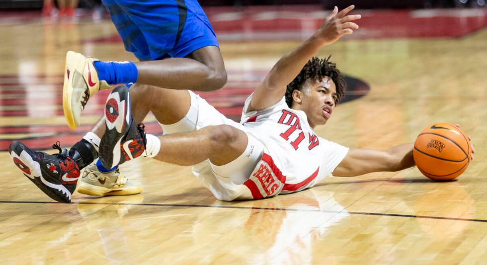 UNLV guard Dedan Thomas Jr. (11) looks for the referee to call a foul during the college basket ...